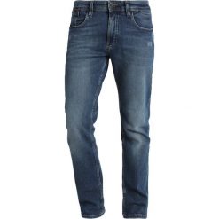 Tommy Jeans Jeansy Slim Fit illinois mid blue stretch destructed. Niebieskie jeansy męskie relaxed fit Tommy Jeans, z bawełny. W wyprzedaży za 411,75 zł.