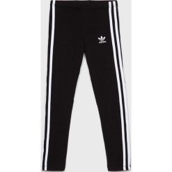Adidas Originals - Legginsy dziecięce 128-170 cm. Czarne spodnie dziewczęce adidas Originals, bez wzorów, z elastanu. W wyprzedaży za 99,90 zł.