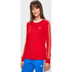 Adidas Originals - Bluza. Czerwone bluzy damskie adidas Originals, bez wzorów, z elastanu, bez rękawów, bez kaptura. W wyprzedaży za 129,90 zł.