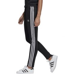 DAMSKIE SPODNIE DRESOWE SST (40). Spodnie damskie Adidas, s, z elastanu. Za 249,99 zł.