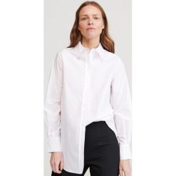 Długa koszula z bawełny organicznej - Biały. Białe koszule damskie Reserved, z bawełny. Za 89,99 zł.