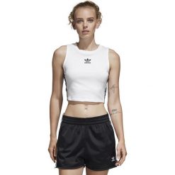 DAMSKA KOSZULKA CROP TANK (34). Żółte koszulki damskie Adidas, w paski, z bawełny, z kontrastowym kołnierzykiem, z krótkim rękawem. W wyprzedaży za 99,99 zł.