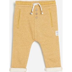 Spodnie dresowe - Beżowy. Brązowe spodnie męskie Reserved, bez wzorów, z dresówki. Za 45,99 zł.