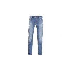 Jeansy slim fit Diesel THOMMER. Niebieskie jeansy męskie regular Diesel, z jeansu. Za 799,00 zł.