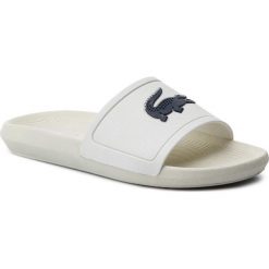 Klapki LACOSTE - Croco Slide 219 1 Cma 7-37CMA0022WN1 Off Wth/Nvy. Białe klapki męskie Lacoste, bez wzorów, z tworzywa sztucznego. W wyprzedaży za 139,00 zł.
