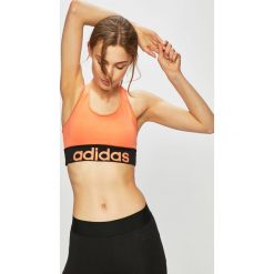 Adidas - Biustonosz sportowy. Pomarańczowe biustonosze sportowe damskie Adidas, s, z poliesteru. W wyprzedaży za 79,90 zł.