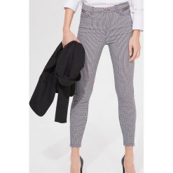 Spodnie skinny - Czarny. Czarne spodnie damskie Mohito. Za 119,99 zł.