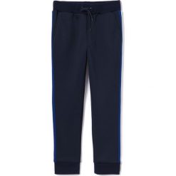 Spodnie dresowe z lampasami 3-12 lat. Niebieskie spodnie dresowe dziewczęce marki La Redoute Collections, z dresówki. Za 83,12 zł.