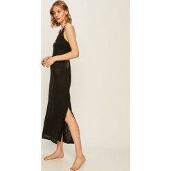 Calvin Klein - Sukienka plażowa. Czarne stroje kąpielowe damskie Calvin Klein, na plażę, s, z nadrukiem, z elastanu, bez kołnierzyka, bez rękawów. W wyprzedaży za 219,90 zł.