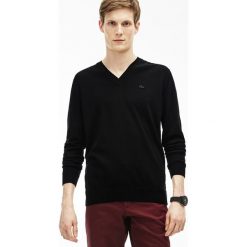 Sweter w kolorze czarnym. Czarne swetry męskie Lacoste, s, z aplikacjami, z wełny, klasyczne. W wyprzedaży za 349,95 zł.