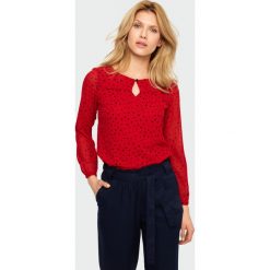 Elegancka bluzka z ozdobnym marszczeniem. Bluzki damskie Greenpoint, bez wzorów, z poliesteru, eleganckie, bez kołnierzyka, bez rękawów. Za 49,99 zł.
