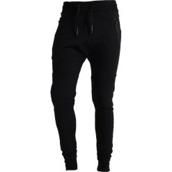 Tigha TREVOR ZIP Spodnie treningowe black. Czarne spodnie dresowe męskie marki Tigha, xxl, z bawełny. Za 379,00 zł.