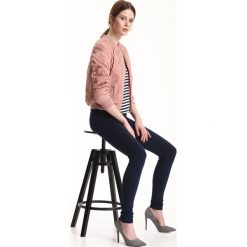 LEGGINSY DAMSKIE. Czarne legginsy damskie TROLL, s, bez wzorów, z tkaniny. W wyprzedaży za 29,99 zł.