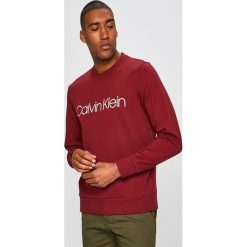 Calvin Klein - Bluza. Brązowe bluzy męskie Calvin Klein, s, bez wzorów, z bawełny, z okrągłym kołnierzem, bez rękawów, bez kaptura. Za 399,90 zł.