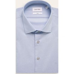Calvin Klein - Koszula. Niebieskie koszule męskie Calvin Klein, bez wzorów, z bawełny, eleganckie, z klasycznym kołnierzykiem, z długim rękawem. W wyprzedaży za 239,90 zł.