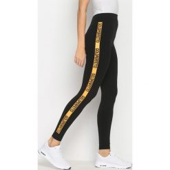 Pomarańczowe Legginsy Gold Gym. Brązowe legginsy sportowe damskie Born2be, l. Za 9,99 zł.