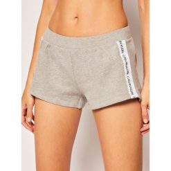 Szorty materiałowe Calvin Klein Swimwear Logo Tape KW0KW01004. Szare szorty damskie Calvin Klein Swimwear, xs, bez wzorów, z bawełny. Za 179,00 zł.