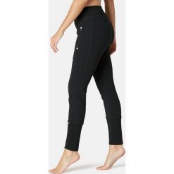 Spodnie dresowe Gym & Pilates 540 damskie. Czarne spodnie damskie DOMYOS, xs, z elastanu. Za 84,99 zł.