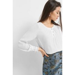 Luźna bluzka z perłami. Brązowe bluzki asymetryczne Orsay, z aplikacjami, z poliesteru, eleganckie. Za 99,99 zł.