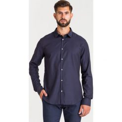 KOSZULA Emporio Armani. Niebieskie koszule męskie Emporio Armani, s, bez wzorów, z bawełny, z klasycznym kołnierzykiem, bez rękawów. Za 739,00 zł.