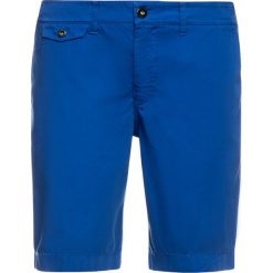 Szorty materiałowe Helly Hansen Hh Bermuda 33940. Pomarańczowe spodenki i szorty męskie Helly Hansen, m, bez wzorów, z bawełny. W wyprzedaży za 169,00 zł.
