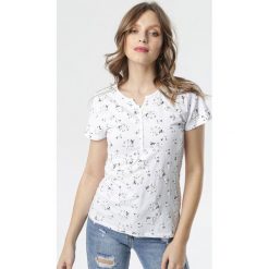 Biały T-shirt Phalinio. Białe bluzki dziewczęce Born2be, w kwiaty, z okrągłym kołnierzem, z krótkim rękawem, krótkie, bez kaptura. Za 39,99 zł.