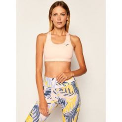 Biustonosz top NIKE Medium-Support Non-Padded BV3630. Różowe topy damskie Nike, l, bez wzorów, bez kołnierzyka. W wyprzedaży za 109,00 zł.