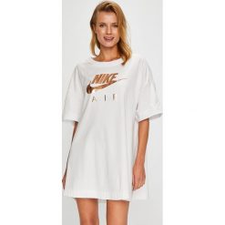 Nike Sportswear - Top. Szare topy damskie Nike Sportswear, m, z nadrukiem, z bawełny, z okrągłym kołnierzem. W wyprzedaży za 129,90 zł.