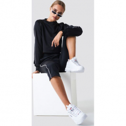 NA-KD Spodnie sportowe - Black. Czarne bryczesy damskie NA-KD, z poliesteru. Za 141,95 zł.
