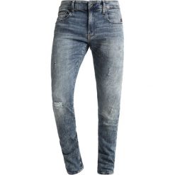 GStar REVEND Jeans Skinny Fit vintage aged destroyed. Niebieskie rurki męskie G-Star, z bawełny. Za 609,00 zł.