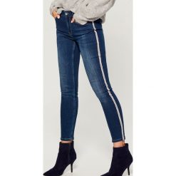 Jeansy skinny high waist z lampasami - Niebieski. Niebieskie jeansy damskie skinny marki Mohito, z podwyższonym stanem. Za 149,99 zł.