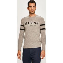 Guess Jeans - Sweter. Niebieskie swetry męskie xs, z aplikacjami, z wełny, z okrągłym kołnierzem. W wyprzedaży za 259,90 zł.