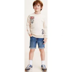 Mango Kids - Szorty dziecięce John 104-164 cm. Niebieskie spodenki chłopięce marki Mango Kids, z aplikacjami, z elastanu, casualowe. Za 69,90 zł.