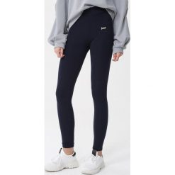 Granatowe Legginsy Kennedi. Legginsy sportowe damskie Born2be, s, z aplikacjami, do biegania. Za 49,99 zł.