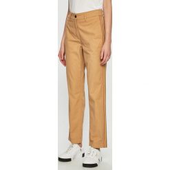 Tommy Hilfiger - Spodnie. Brązowe spodnie damskie TOMMY HILFIGER, bez wzorów, z bawełny. W wyprzedaży za 329,90 zł.