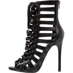 Steve Madden FANTASIZE Sandały na obcasie black. Czarne sandały damskie Steve Madden, z materiału, na obcasie. Za 589,00 zł.