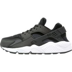 Nike Sportswear HUARACHE Sneakersy niskie black/white. Czarne trampki i tenisówki damskie Nike Sportswear, bez wzorów, z tworzywa sztucznego, bez zapięcia. Za 499,00 zł.