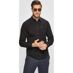 Calvin Klein Jeans - Koszula. Niebieskie koszule męskie Calvin Klein Jeans, s, bez wzorów, z bawełny, klasyczne, z klasycznym kołnierzykiem, z długim rękawem. W wyprzedaży za 269,90 zł.