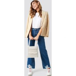 MANGO Jeansy vintage z rozdarciami - Blue. Niebieskie spodnie z wysokim stanem Mango, z jeansu. Za 202,95 zł.