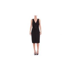 Sukienki krótkie Moschino J04385541. Czarne sukienki damskie MOSCHINO, bez wzorów, bez kołnierzyka, z krótkim rękawem, krótkie, mini. Za 1761,25 zł.
