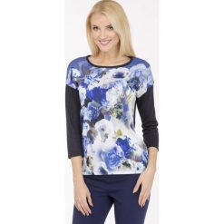 T-shirt z akwarelowym nadrukiem. Szare bluzki damskie marki Monnari, z nadrukiem, z wiskozy, bez kołnierzyka, bez rękawów. Za 47,60 zł.