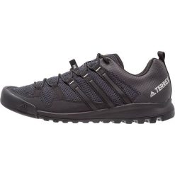 Adidas Performance TERREX SOLO Obuwie hikingowe dark grey/core black/solid grey. Szare buty sportowe męskie marki adidas Performance, z tworzywa sztucznego, bez zapięcia, outdoorowe. Za 549,00 zł.