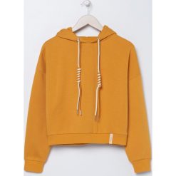 Bluza typu crop z ozdobnymi ściagaczami - Żółty. Żółte bluzy damskie Sinsay, s, bez wzorów, bez rękawów, bez kaptura. Za 49,99 zł.