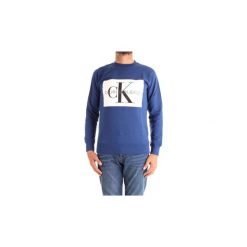 Bluzy Calvin Klein Jeans J30J307746. Niebieskie bluzy męskie marki Calvin Klein Jeans, xl, bez wzorów, z jeansu, bez kołnierzyka, bez rękawów, bez kaptura. Za 235,53 zł.