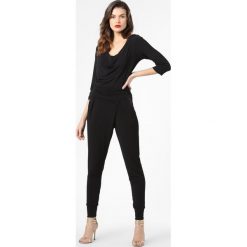 Cartoon Daydream - Kombinezon damski, czarny. Czarne kombinezony damskie Cartoon Daydream, bez wzorów, eleganckie, bez kołnierzyka, bez rękawów. Za 349,95 zł.