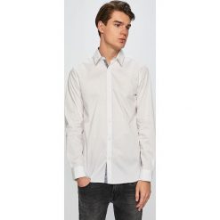 Guess Jeans - Koszula. Białe koszule męskie Guess Jeans, xl, z aplikacjami, z elastanu, eleganckie, z klasycznym kołnierzykiem, z długim rękawem. W wyprzedaży za 169,90 zł.