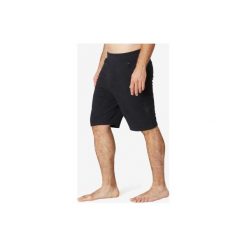 Spodenki Gym & Pilates 900 Slim męskie. Czarne spodenki i szorty męskie DOMYOS, m, bez wzorów, z elastanu. Za 69,99 zł.