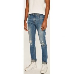 Guess Jeans - Jeansy Chris Skin Tight. Niebieskie jeansy męskie Guess Jeans, m, z aplikacjami. Za 499,90 zł.