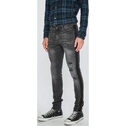 Jack & Jones - Jeansy Liam. Szare jeansy męskie Jack & Jones, bez wzorów, z obniżonym stanem. W wyprzedaży za 139,90 zł.