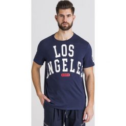 T-SHIRT GUESS. Niebieskie t-shirty męskie Guess, s, z nadrukiem, z bawełny, z okrągłym kołnierzem. Za 118,30 zł.